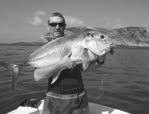 Bill Robertson scored this trevally on a gold Popper at Keppel.